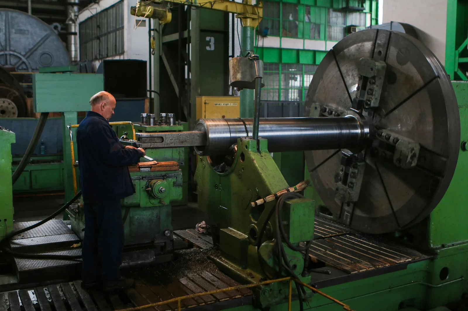 Industrial worker reviewing documents